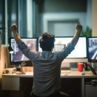 man dark office with his arms up air celebrating his victory 895799 6063 man dark office with his arms up air celebrating his victory 895799 6063